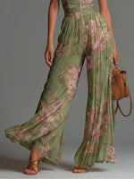 Luzia | Elegante Mono de Gasa Verde con Estampado Floral, Escote en V, Sin Mangas, Cremallera y Pernera Ancha Plisada
