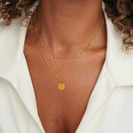 Collar con disco laminado